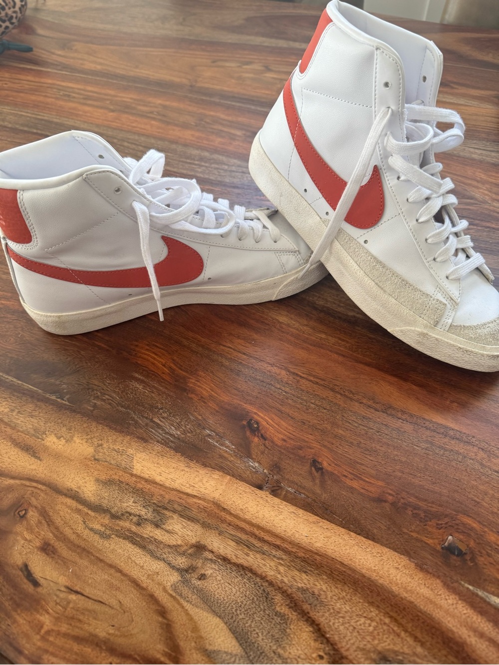 Nike White High-Top Sneakers with Red Swoosh Accent